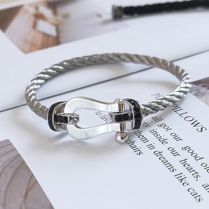 [Aetheris]FORCE GROSSES HUFEISEN-ARMBAND MIT SCHWARZER DIAMANTENVERZIERUNG - WEISSGOLD